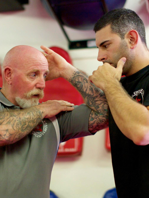 Mick Nicholls demonstrating elbow spike.